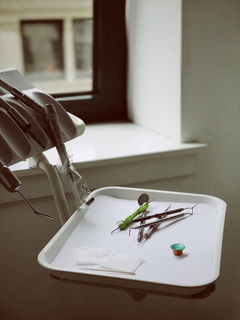 A tray of dental tools used for dental cleanings